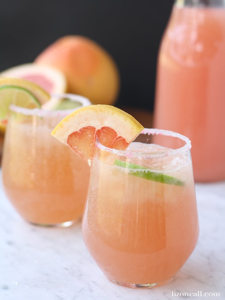 glasses and a pitcher of sparkling grapefruit punch