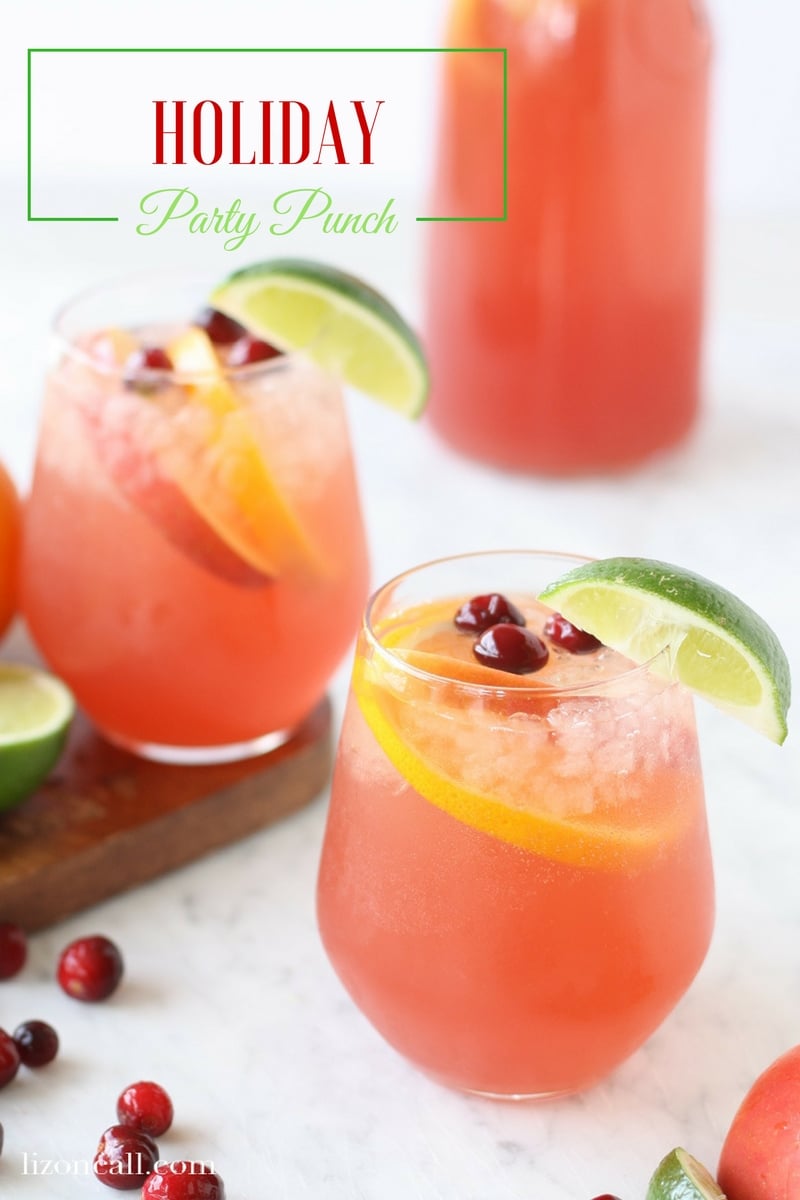 titled image (and shown): Holiday party punch (glasses of pink punch garnished with fresh fruit